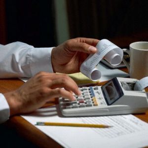 man using calculator